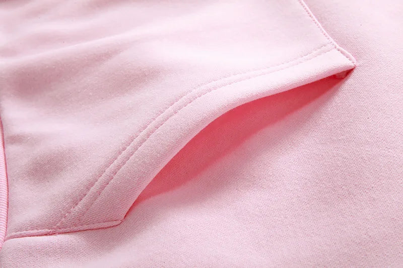 Close-up of the soft fabric detail of the women's cat ear hoodie UAE in pink color