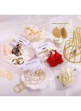 Fashion earring set with gold-tone drops and red tassel dangles