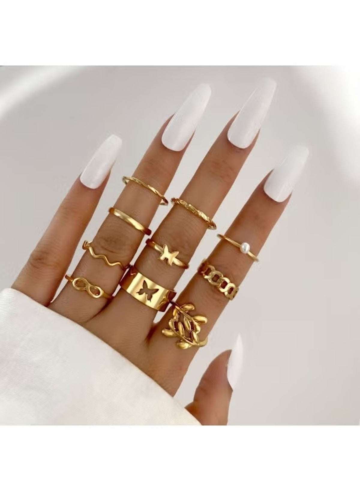 Stylish women's gold fashion ring set featuring multiple unique designs and delicate details