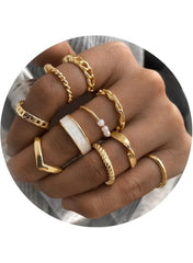 Stylish women's gold ring set featuring various designs and textures for trendy accessories