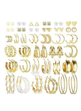 Gold-tone fashion earrings assortment: hoops, studs, hearts, and pearl dangles in one set