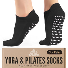 Black womens grip socks for yoga with white non-slip dots on soles by All Things Accessory