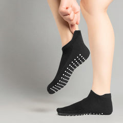 Black womens grip socks for yoga with non-slip dots on soles for enhanced stability and comfort