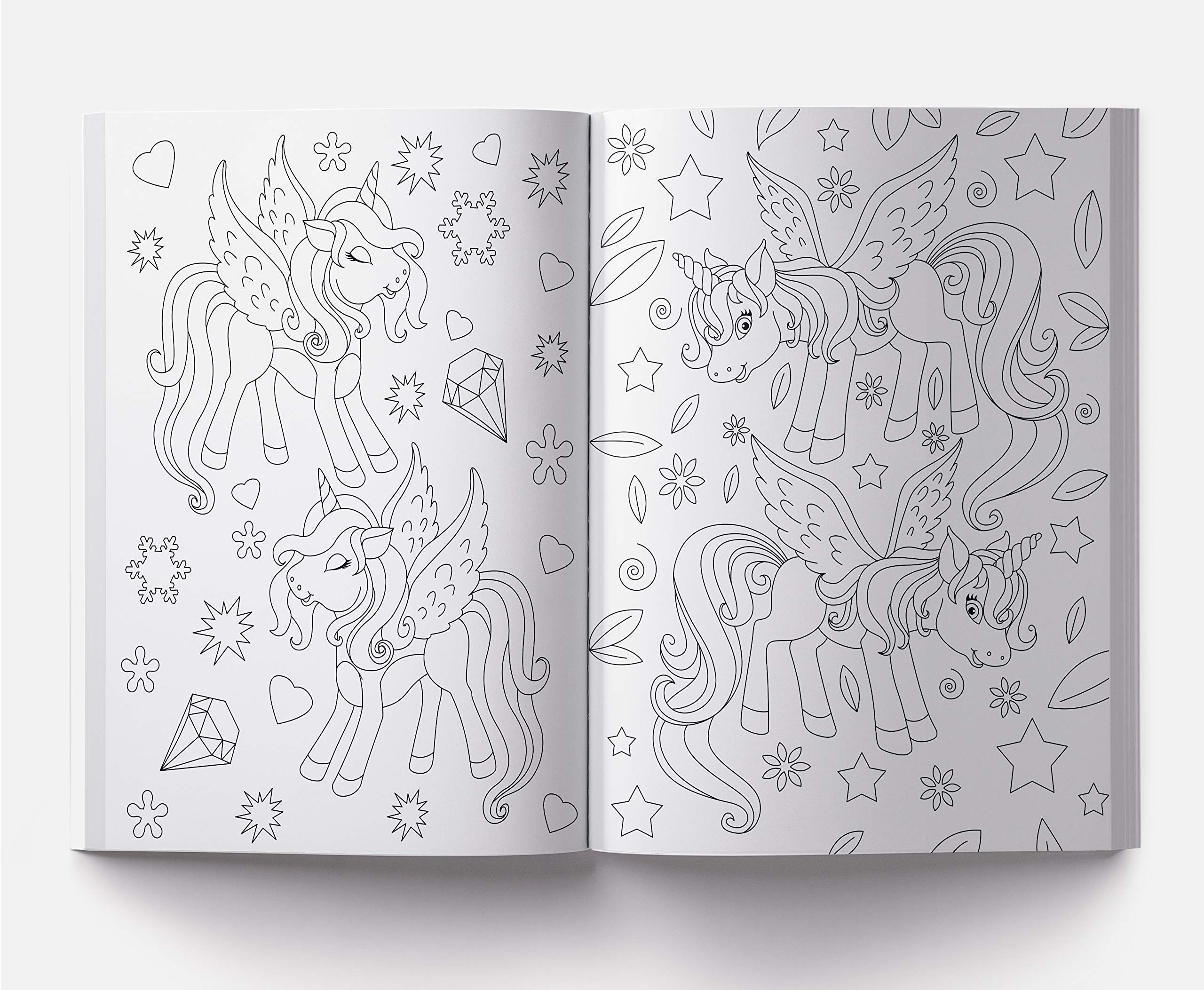 Open coloring book featuring 101 unicorn coloring pages with winged unicorns and decorative stars and hearts