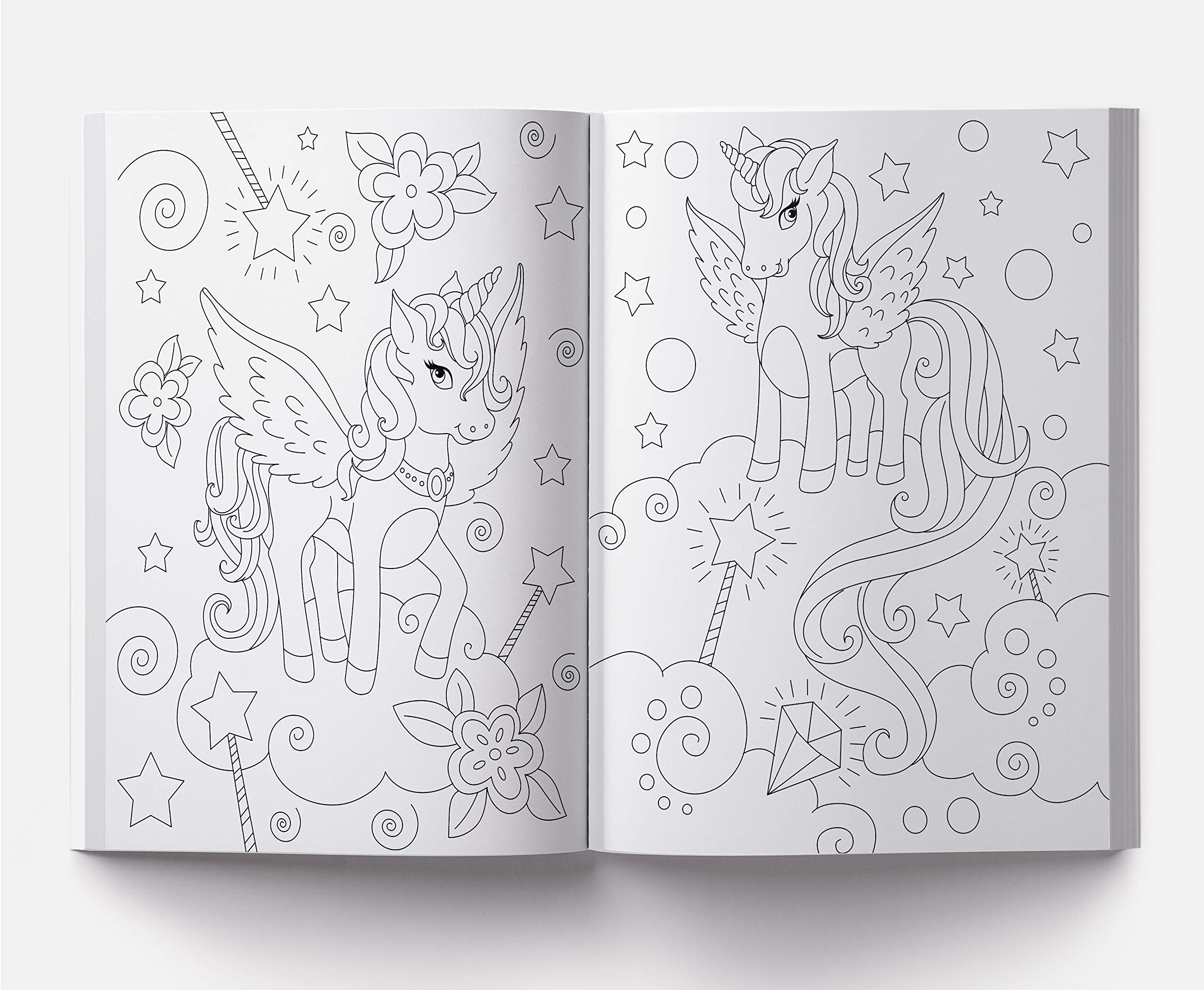 Open coloring book featuring two winged unicorns and stars from the 101 unicorn coloring pages collection