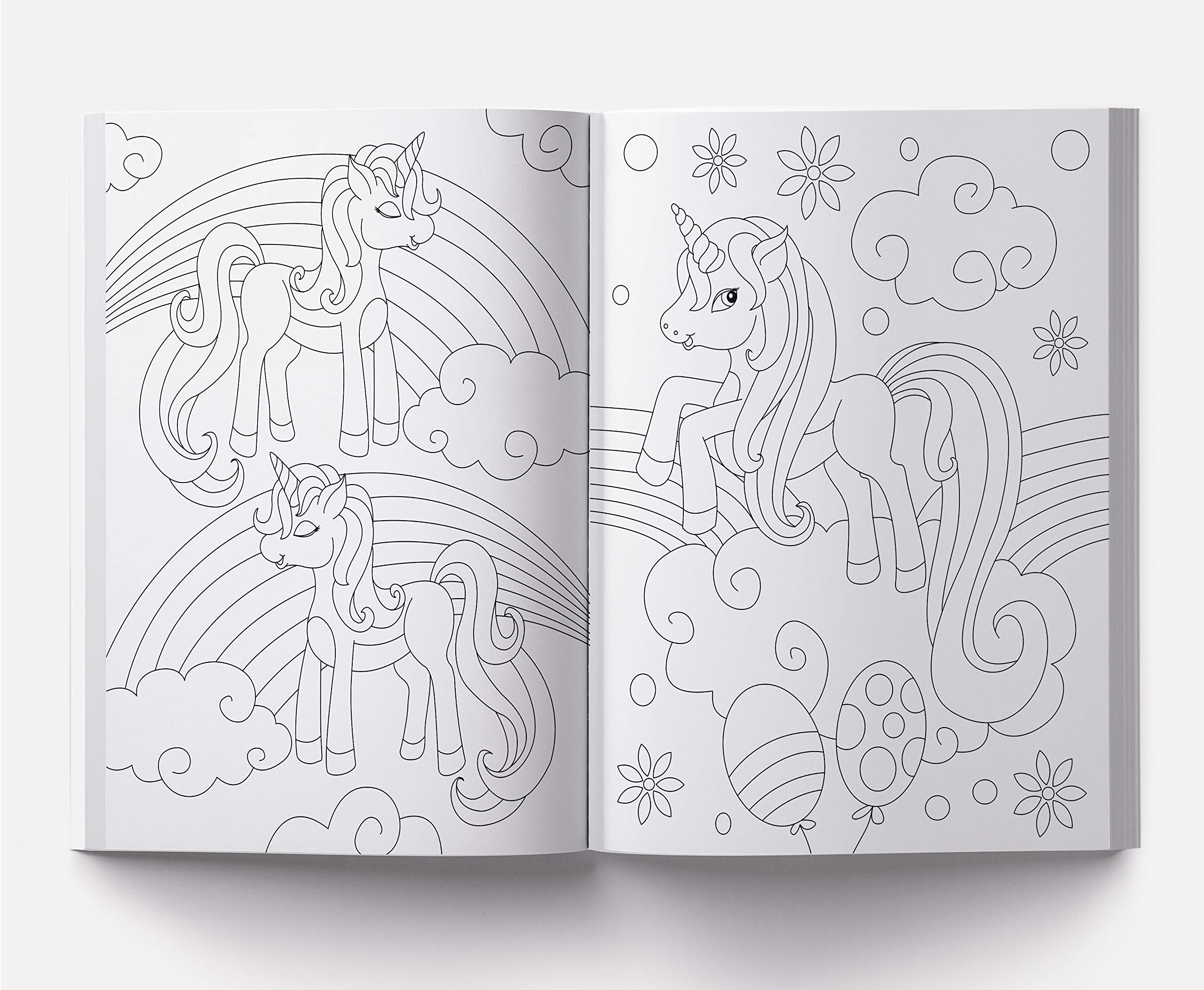 Open coloring book showing 101 unicorn coloring pages with unicorns, rainbows, clouds, and balloons