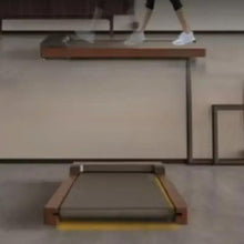 Folded portable treadmill with dark deck and wood-grain frame, yellow support legs