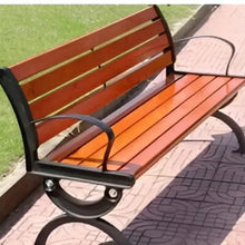 Wooden patio bench with curved dark armrests, orange-brown slatted seat and back
