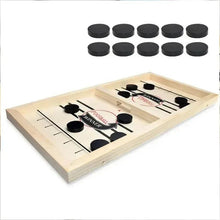 Wooden puck game board with dark round pucks and a spare set of pucks above