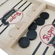 Wooden puck game board with dark round pucks in a wooden track