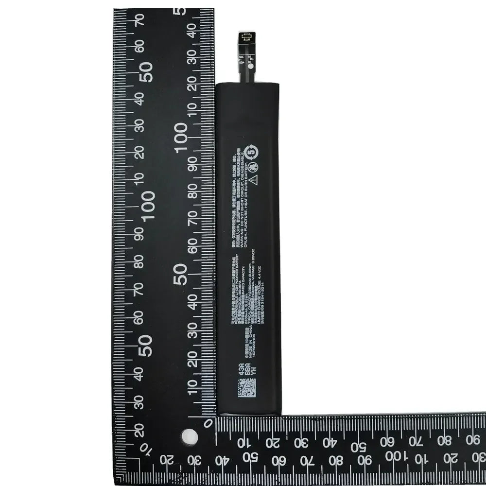 BS06FA battery for Xiaomi Black Shark 3 slim replacement battery pack shown next to measuring rulers by Mumzar