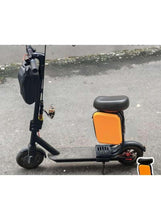 Scooter seat and storage box attachment with black frame and orange panel
