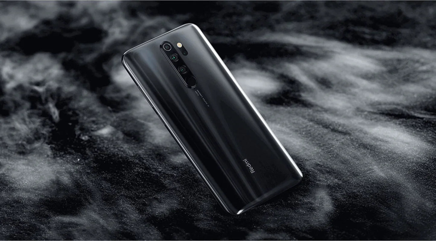 used Redmi Note 8 Pro for sale black back view shows quad camera module on smoky dark background Mumzar
