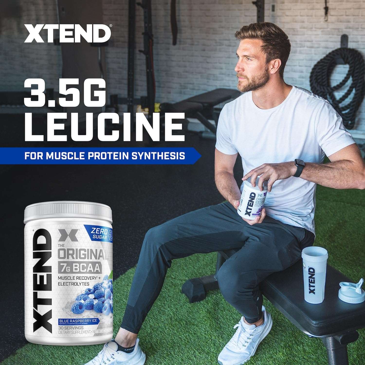 Man in gym holding Xtend shaker with Xtend BCAA powder zero sugar tub shown for muscle recovery and protein synthesis
