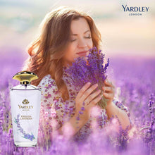 Yardley English Lavender eau de toilette bottle with gold cap beside purple flowers