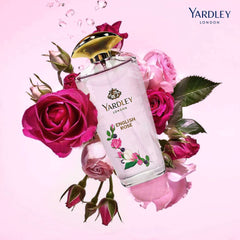 Yardley London English Rose gift set perfume bottle surrounded by pink and red roses on light pink background