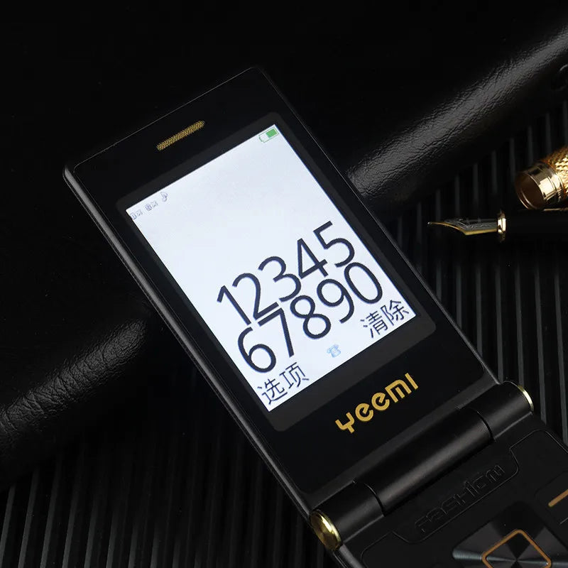 Mumzar dual SIM flip phone for seniors black clamshell with large numeric display gold accents and keypad
