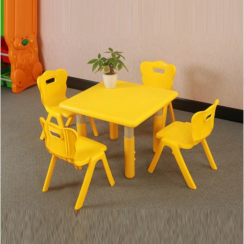 Huitich yellow indoor furniture for children study table with four matching yellow chairs and plant on top