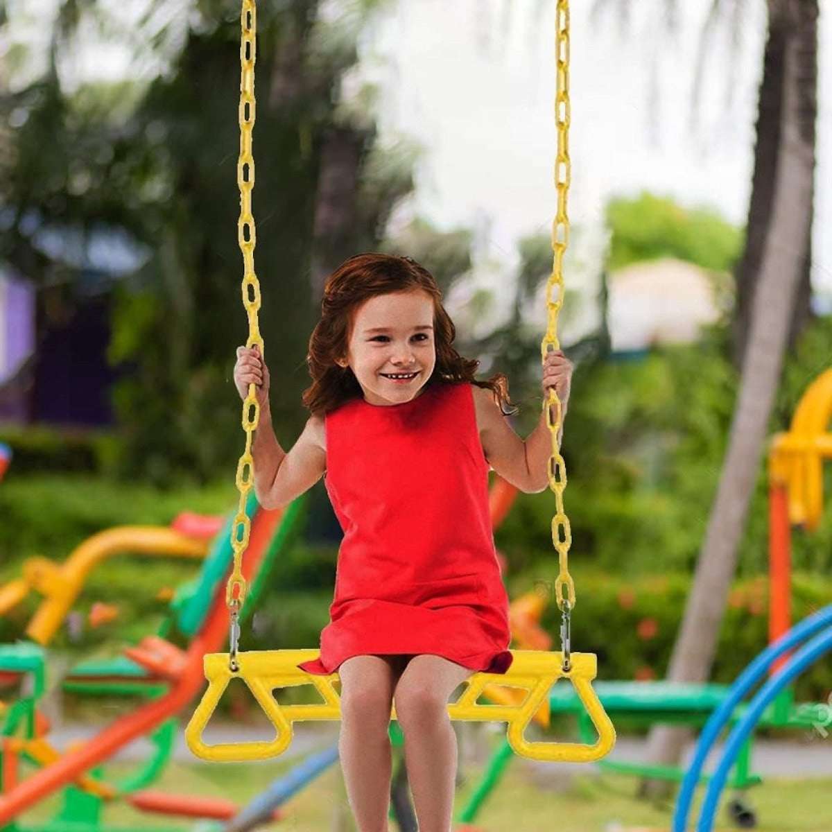 Child swinging on a yellow swing set featuring yellow park gym ring bar for outdoor play
