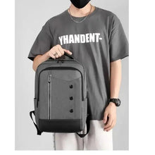Large capacity travel backpack worn on person, front zip pocket, dark gray