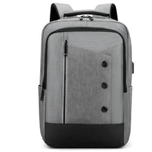 Gray large travel backpack with front zip pocket and black accents.